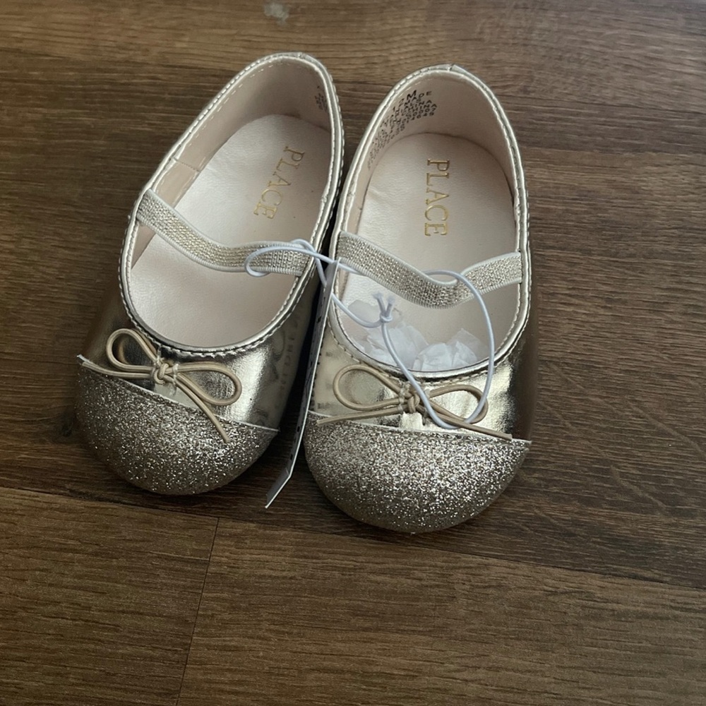 Children place dress shoes